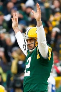 GREEN BAY, WI - JANUARY 11: Aaron Rodgers #12 of the Green Bay Packers reacts after completing a pass against the Dallas Cowboys during the 2015 NFC Divisional Playoff game at Lambeau Field on January 11, 2015 in Green Bay, Wisconsin. The Packers defeated the Cowboys 26-21. (Photo by Al Bello/Getty Images)